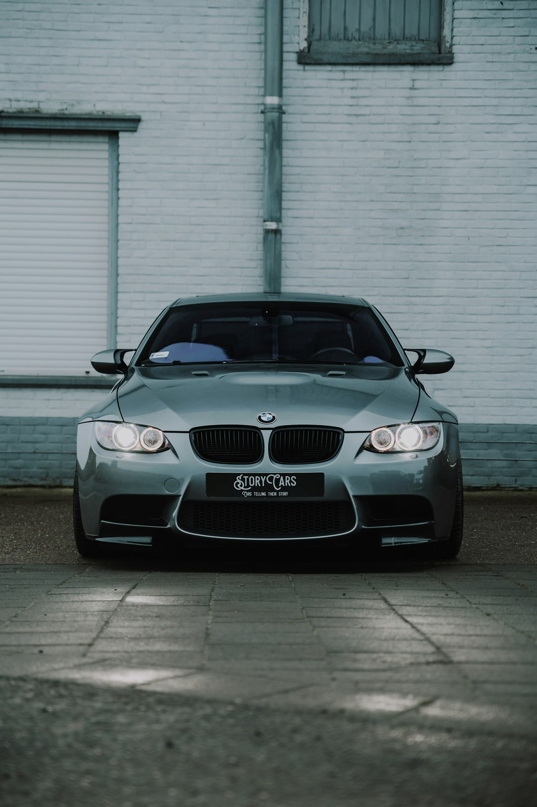 grey e92 m3 on a dealer plate, which means somebody is about to spend a lot of money. the last m3 with a naturally aspir
