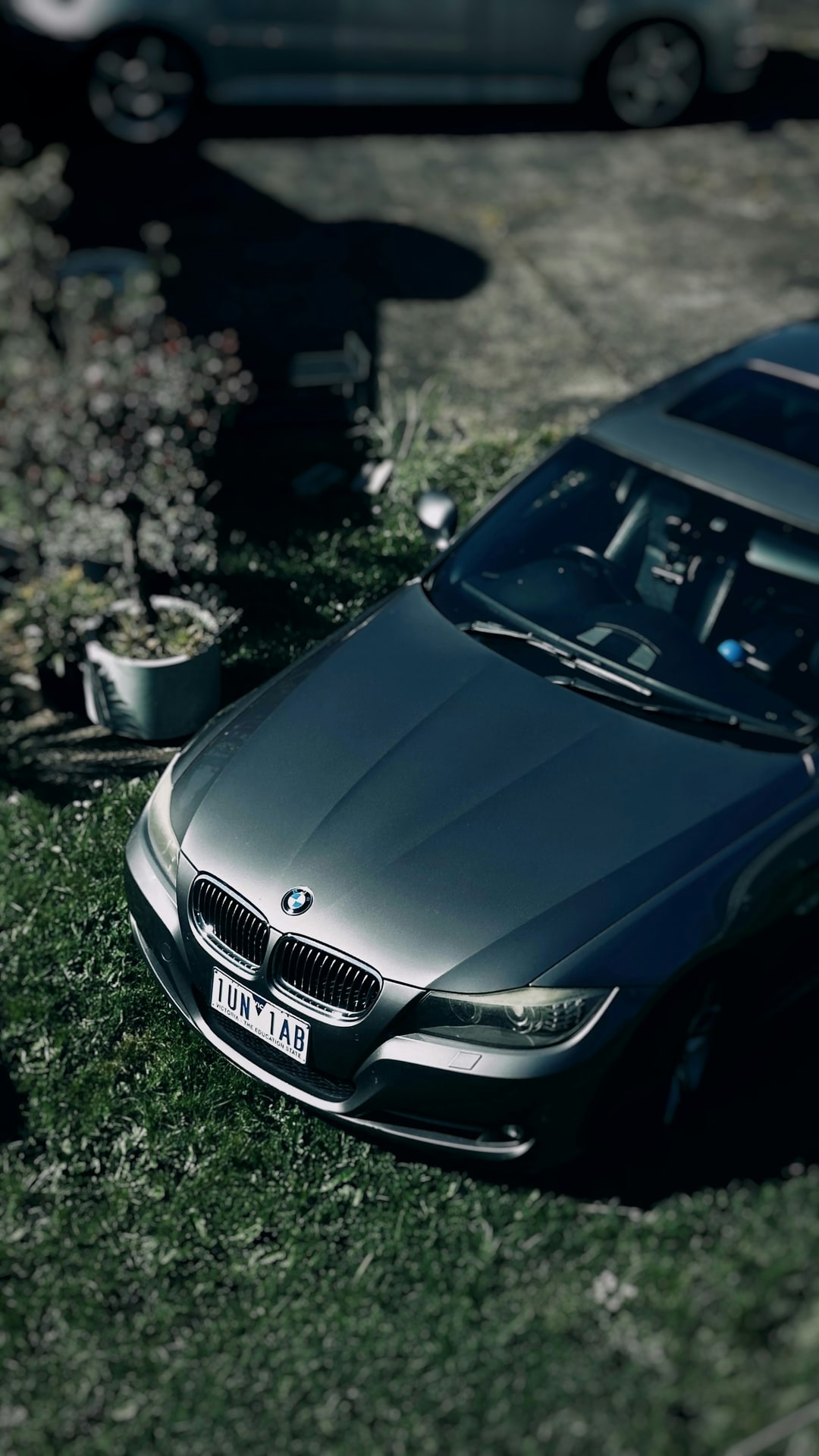 Vic plates on an E90 parked up on the lawn like it belongs there. Not my usual thing, I am a Commodore bloke. But a face