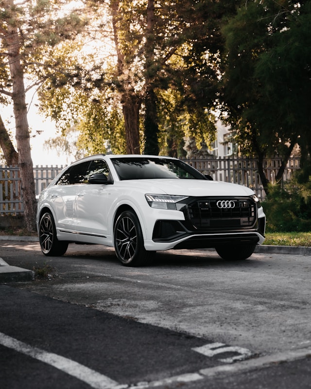 The Audi Q8 wide stance, frameless doors, and aggressive front grille pay homage to the original Quattro, blending class