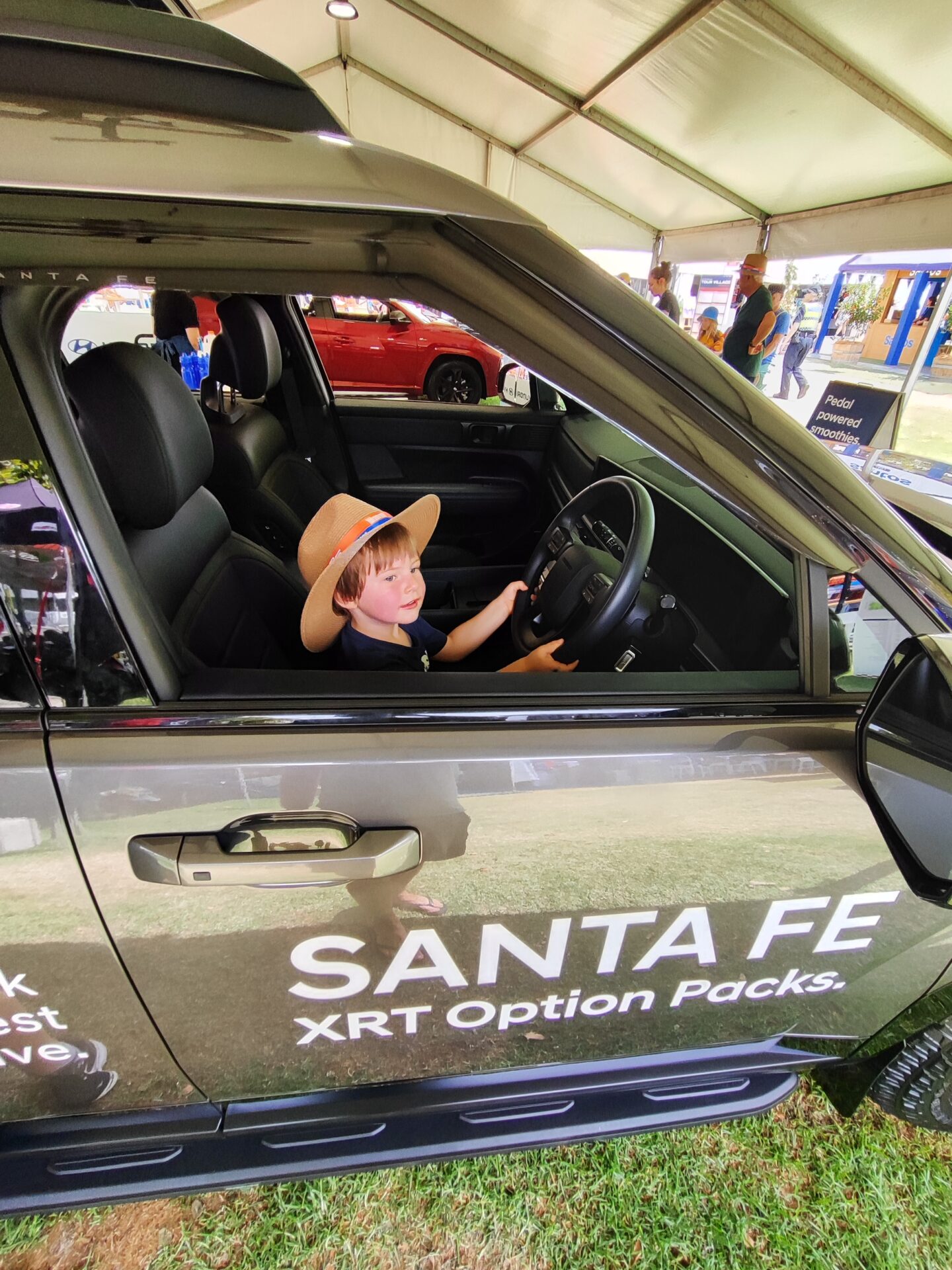Me checking out the new 2025 Hyundai Santa Fe MX5 at the Santos tour down under. Do you like my hat? #loveit #dadgetonep