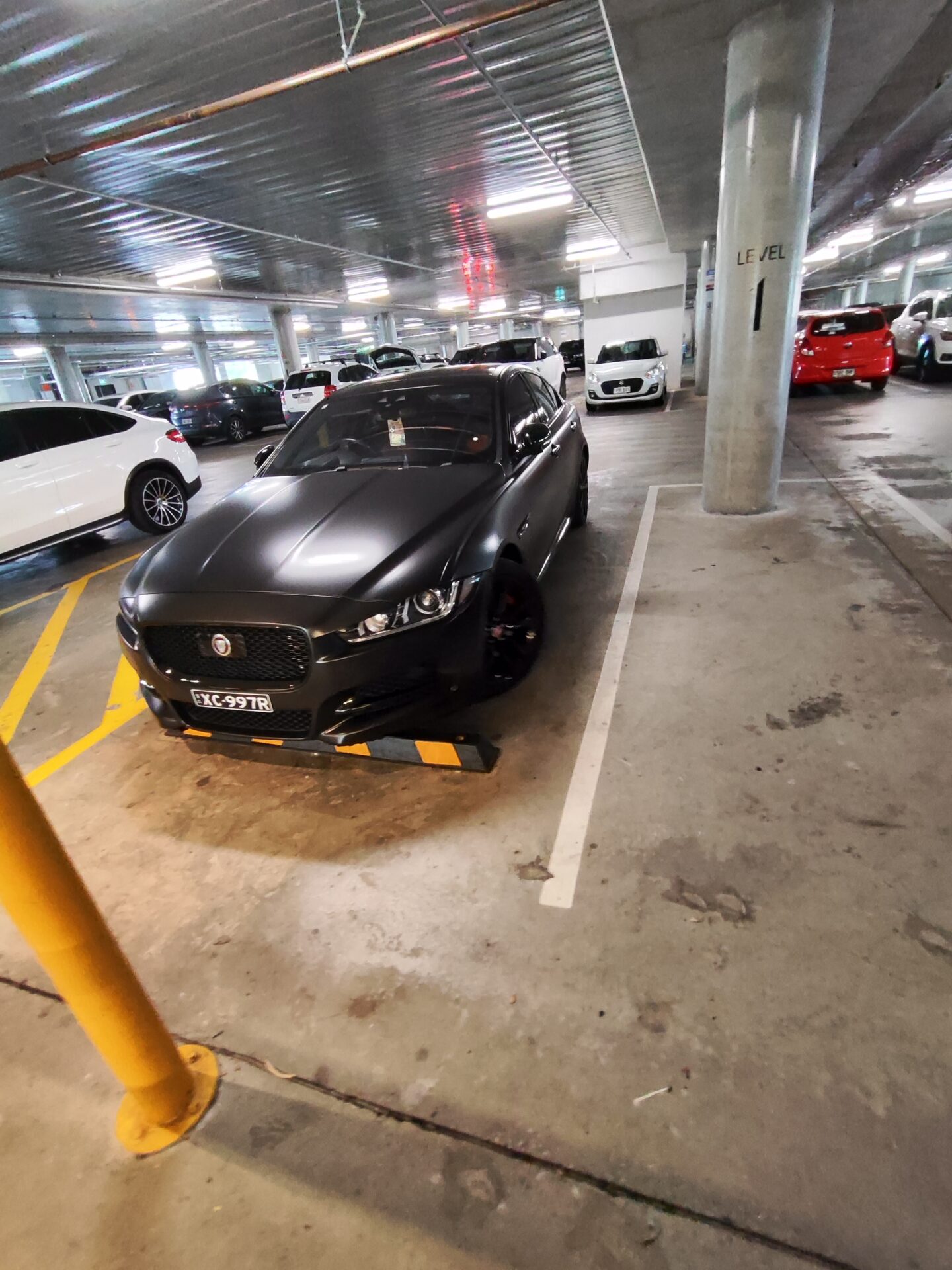 I think it is a Jaguar XF X260 correct me if I am wrong. Looks pretty nice in a satin black. Disabled stick in the windo
