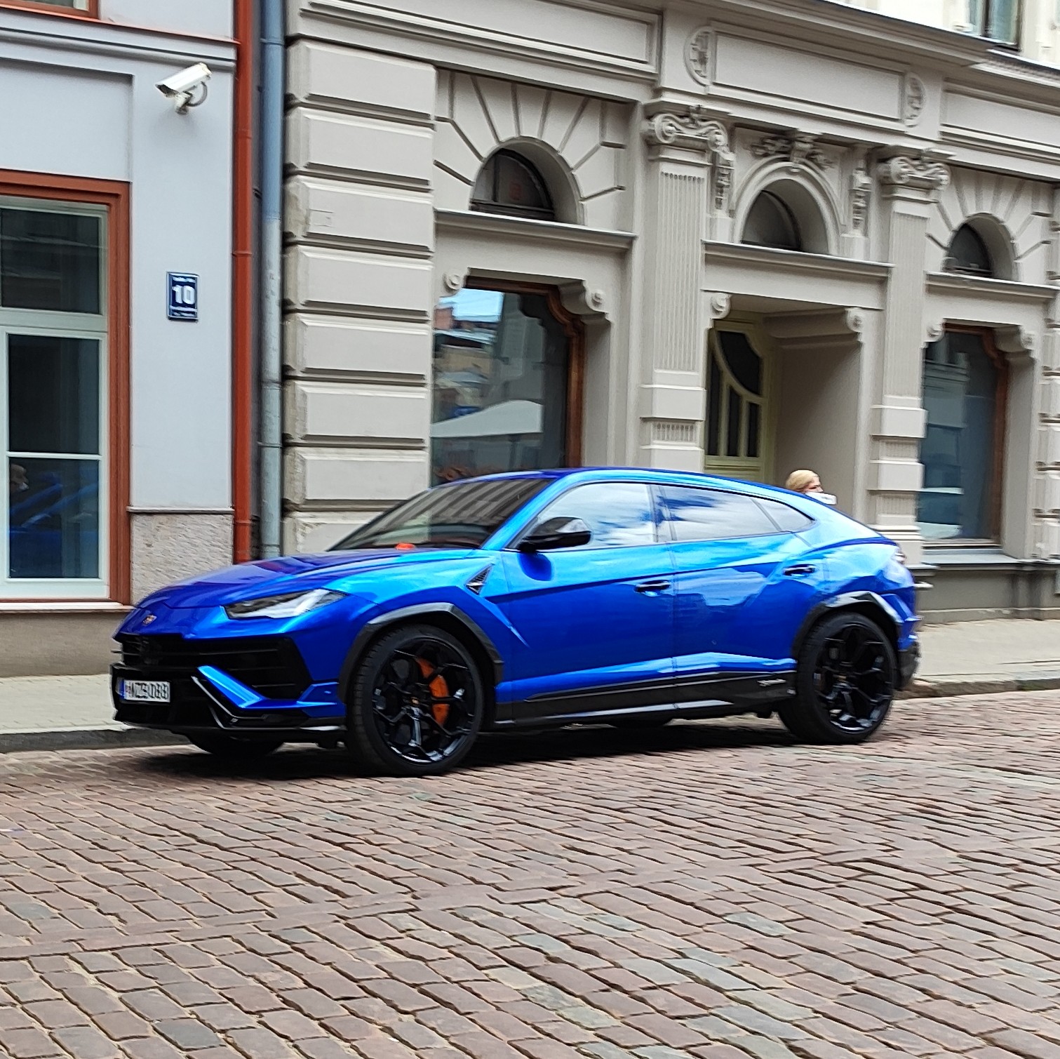 We are #latvia meeting some new friends and some old. Nice blue Lamborghini Urus just chilling in old town.