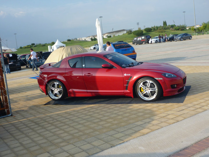 The RX-8 was designed with a front-mid-engine layout, placing the compact and light rotary engine behind the front axle.